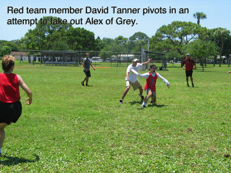 [picture: Red team member David Tanner pivots in an attempt to fake out Alex of Grey]